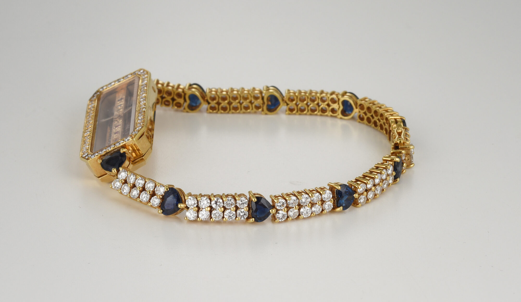 1980s Ladie's Corum Golden Bridge watch in 18K Yellow Gold w/Diamonds & Sapphires Ref.13104 - Image 7