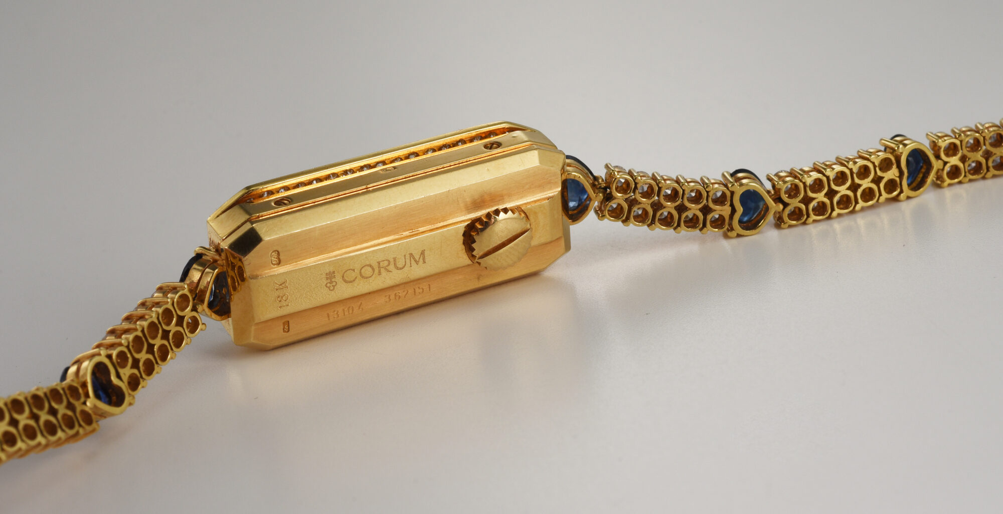 1980s Ladie's Corum Golden Bridge watch in 18K Yellow Gold w/Diamonds & Sapphires Ref.13104 - Image 10