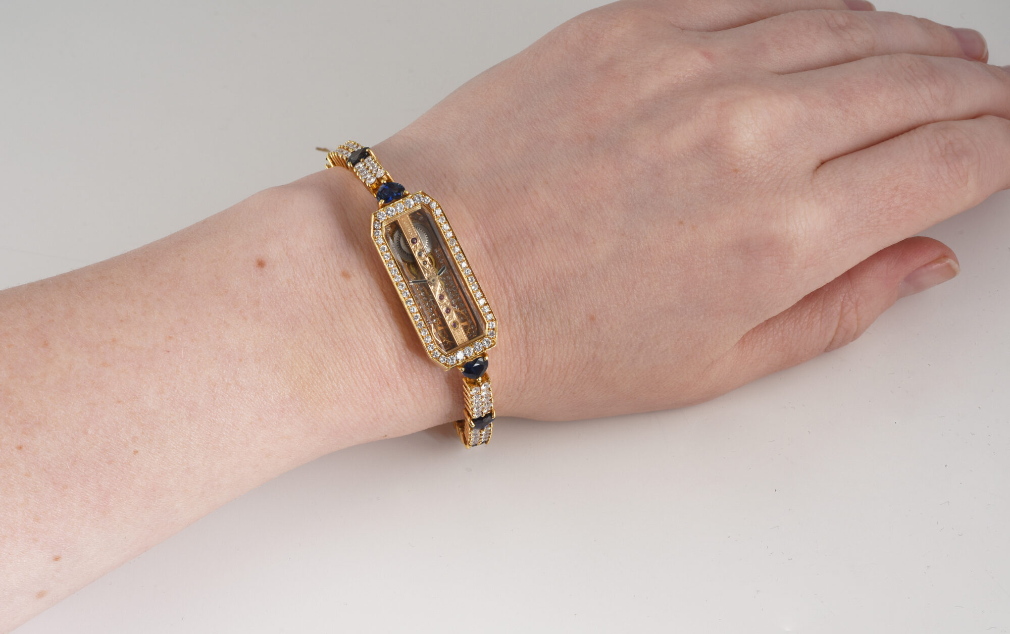 1980s Ladie's Corum Golden Bridge watch in 18K Yellow Gold w/Diamonds & Sapphires Ref.13104 - Image 2