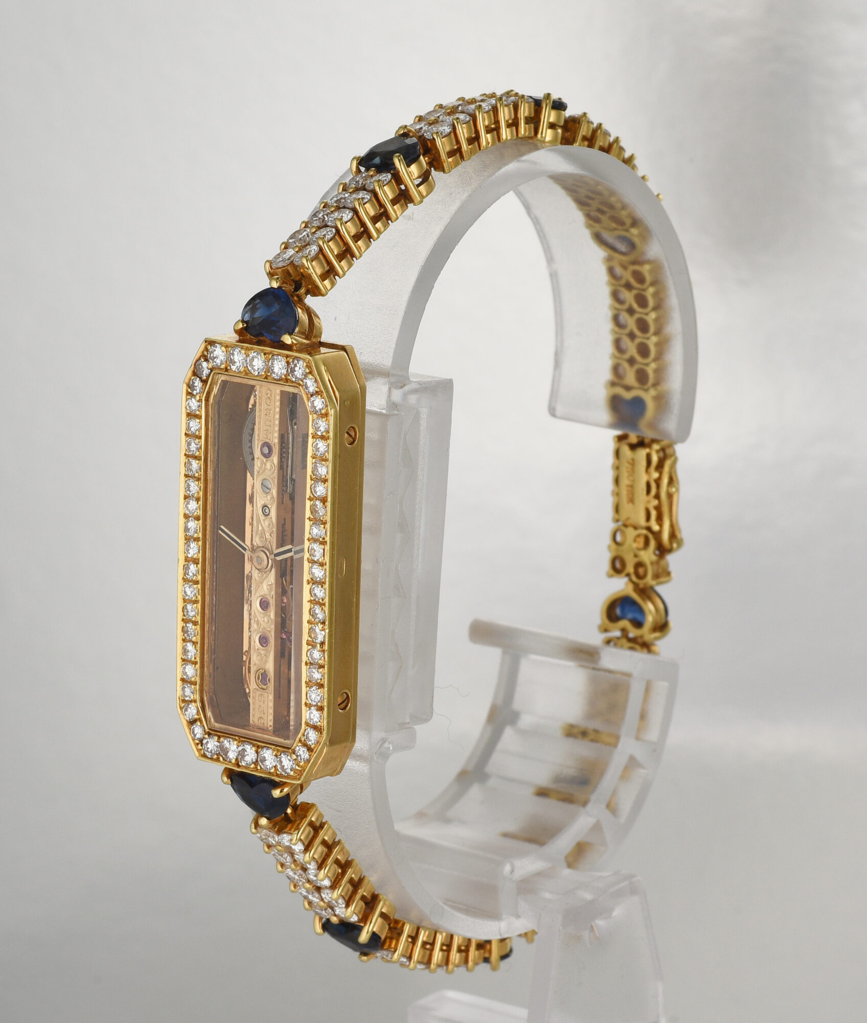 1980s Ladie's Corum Golden Bridge watch in 18K Yellow Gold w/Diamonds & Sapphires Ref.13104 - Image 4