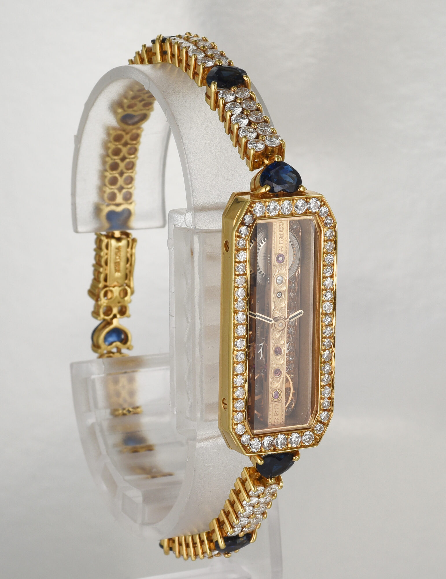 1980s Ladie's Corum Golden Bridge watch in 18K Yellow Gold w/Diamonds & Sapphires Ref.13104 - Image 3